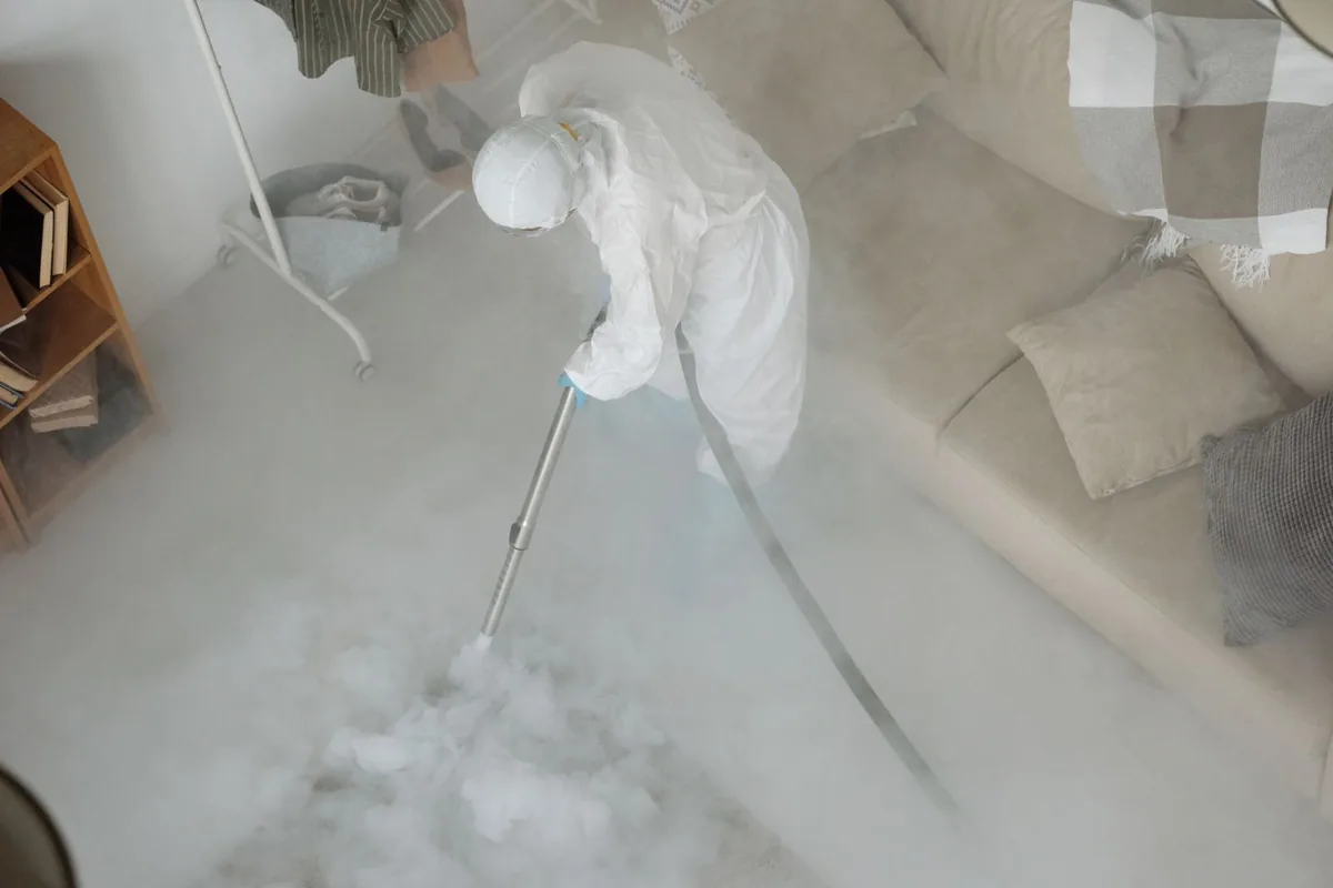 Biohazard cleanup technician in protective equipment, Epworth, GA